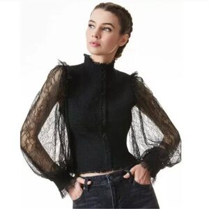 Alice & Olivia black top. Lace sleeves. Excellent condition.